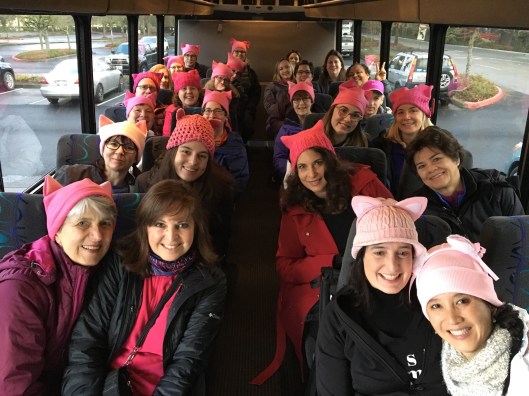 On a bus with people I just met five minutes ago, in mostly-matching homemade hats